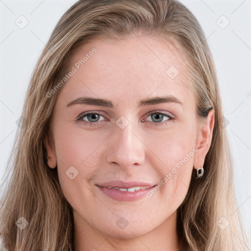 Joyful white young-adult female with long  brown hair and blue eyes