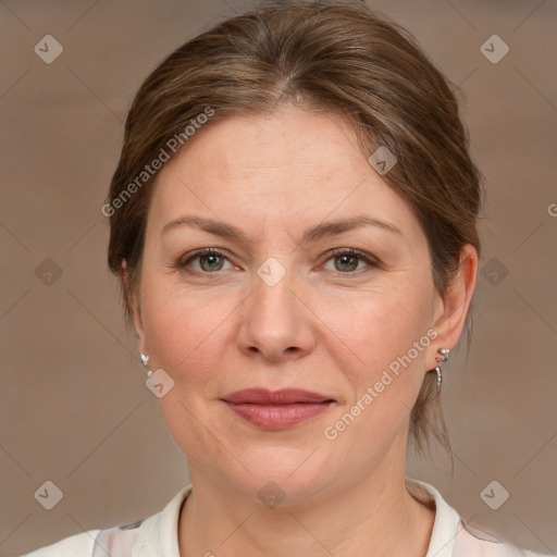 Joyful white adult female with medium  brown hair and grey eyes