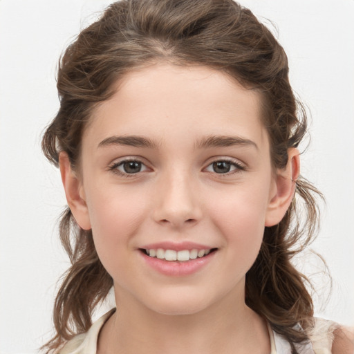 Joyful white child female with medium  brown hair and brown eyes