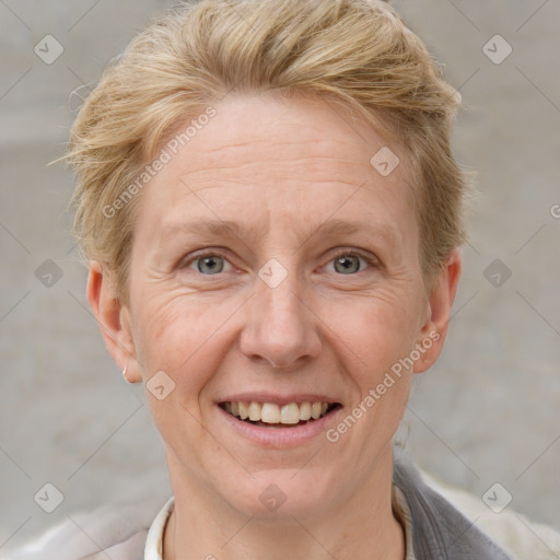 Joyful white adult female with short  brown hair and grey eyes