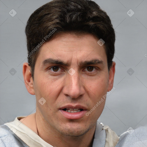 Joyful white adult male with short  brown hair and grey eyes