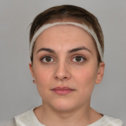 Neutral white young-adult female with short  brown hair and brown eyes