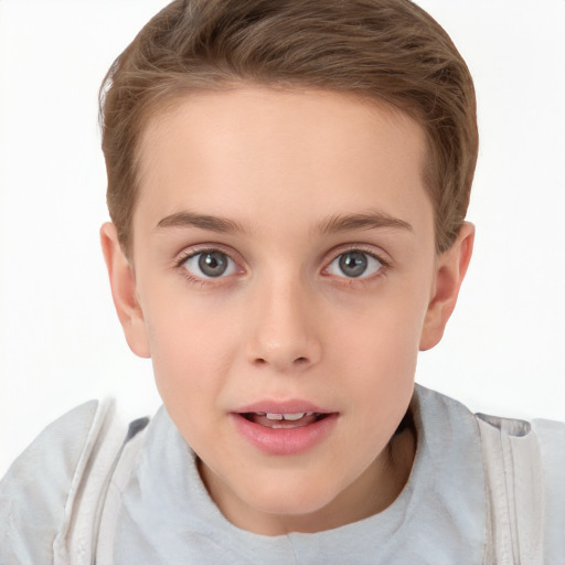 Joyful white child female with short  brown hair and brown eyes