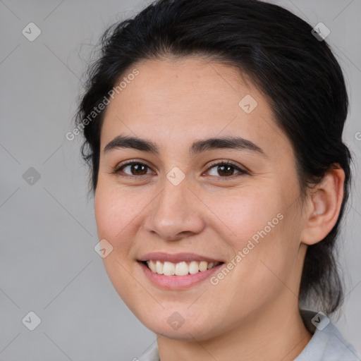 Joyful white young-adult female with medium  brown hair and brown eyes