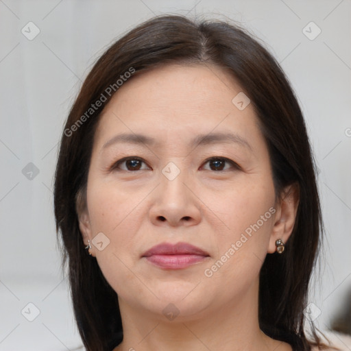 Joyful white adult female with medium  brown hair and brown eyes