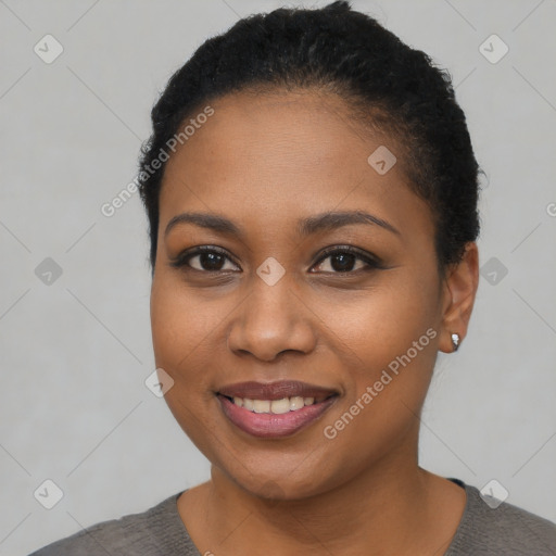 Joyful black young-adult female with short  black hair and brown eyes