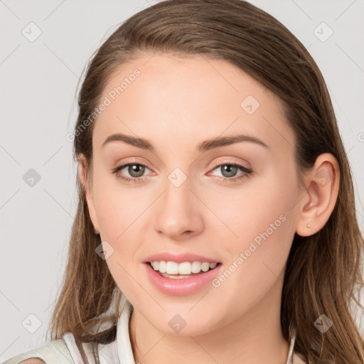 Joyful white young-adult female with long  brown hair and blue eyes