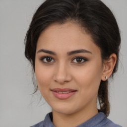 Joyful white young-adult female with medium  brown hair and brown eyes