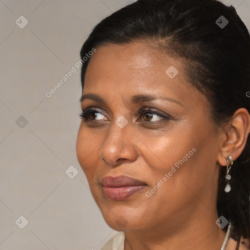 Joyful black adult female with short  brown hair and brown eyes