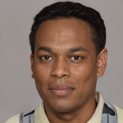 Neutral black young-adult male with short  black hair and brown eyes