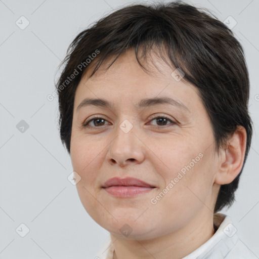 Joyful white adult female with medium  brown hair and brown eyes