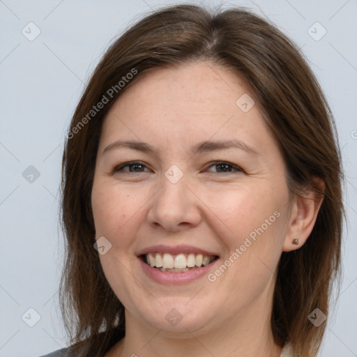 Joyful white adult female with medium  brown hair and brown eyes