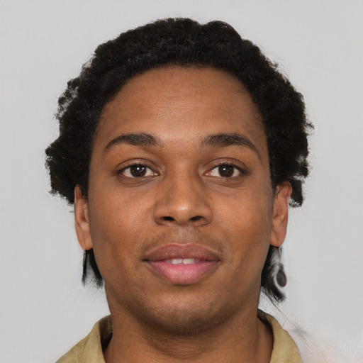 Joyful black young-adult female with short  black hair and brown eyes