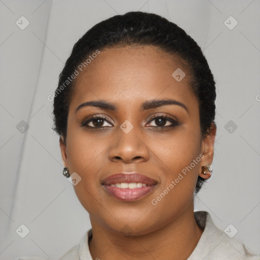 Joyful black young-adult female with short  black hair and brown eyes