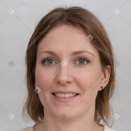 Joyful white young-adult female with medium  brown hair and blue eyes