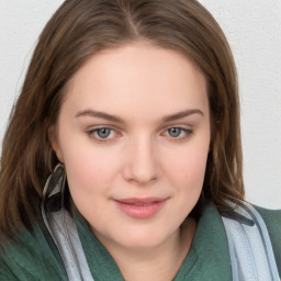 Joyful white young-adult female with medium  brown hair and blue eyes