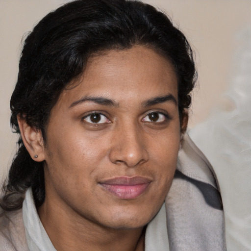 Joyful latino adult female with short  brown hair and brown eyes