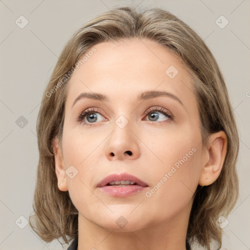 Neutral white young-adult female with medium  brown hair and grey eyes