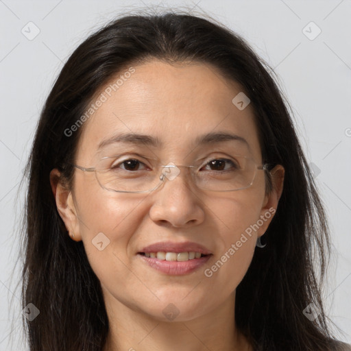 Joyful white adult female with long  brown hair and brown eyes