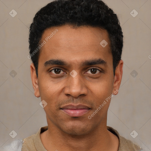 Joyful black young-adult male with short  black hair and brown eyes