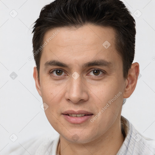 Joyful white young-adult male with short  brown hair and brown eyes