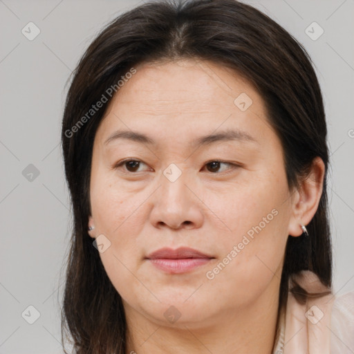 Joyful white adult female with medium  brown hair and brown eyes