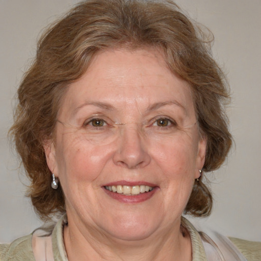 Joyful white middle-aged female with medium  brown hair and blue eyes