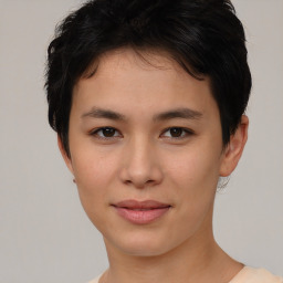 Joyful asian young-adult female with short  brown hair and brown eyes