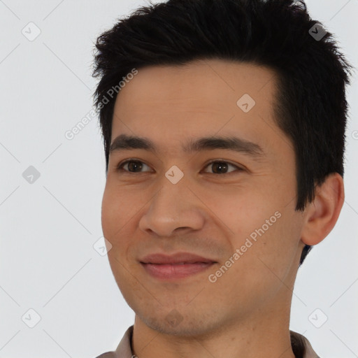 Joyful asian young-adult male with short  black hair and brown eyes