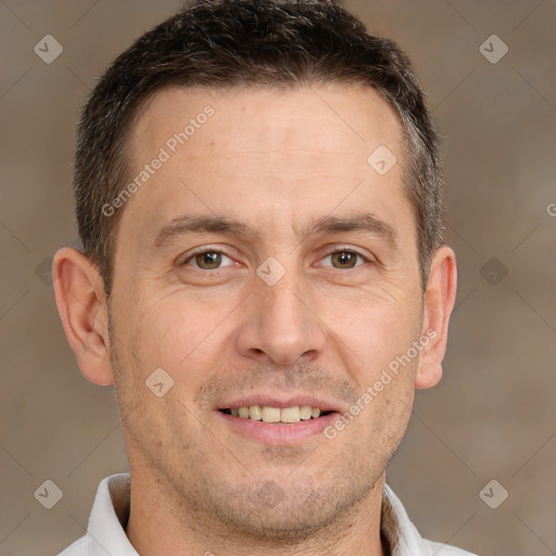 Joyful white adult male with short  brown hair and brown eyes