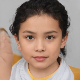 Joyful white child female with medium  brown hair and brown eyes