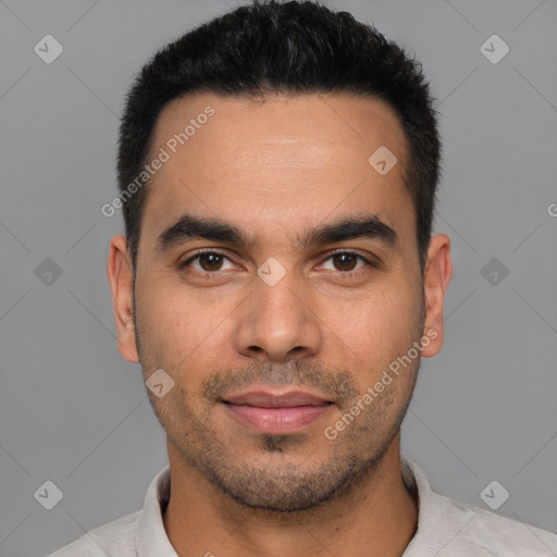 Joyful white young-adult male with short  black hair and brown eyes