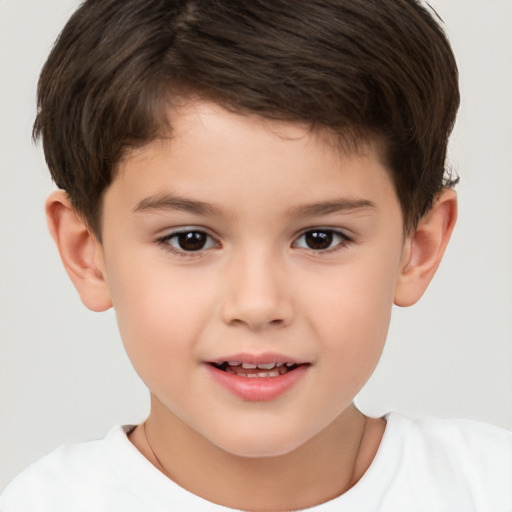 Joyful white child male with short  brown hair and brown eyes