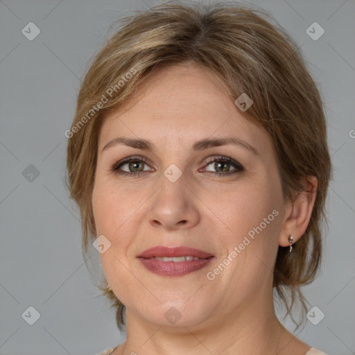 Joyful white adult female with medium  brown hair and grey eyes