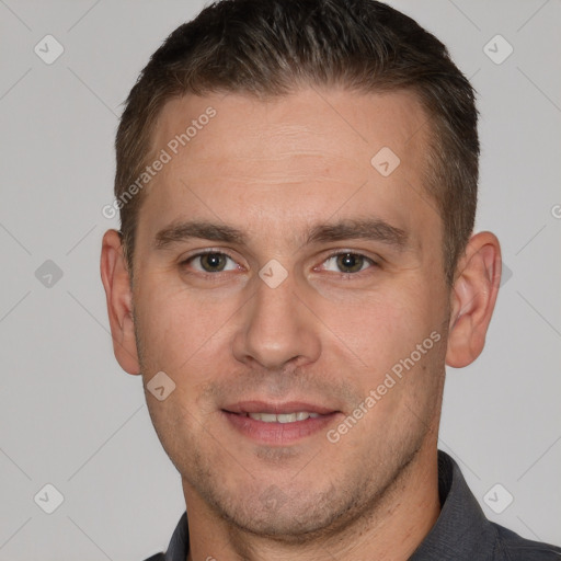 Joyful white adult male with short  brown hair and brown eyes