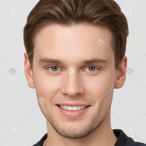 Joyful white young-adult male with short  brown hair and grey eyes