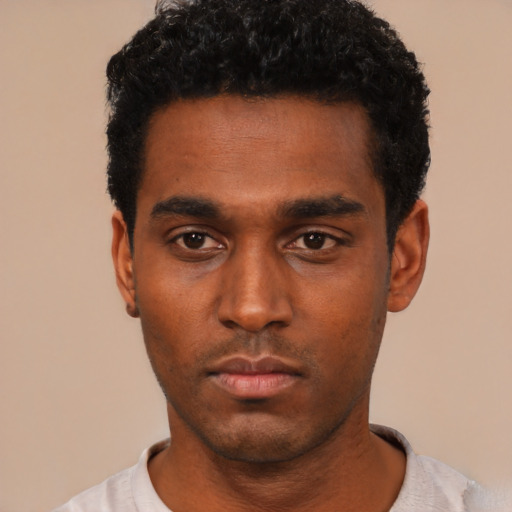Neutral black young-adult male with short  black hair and brown eyes