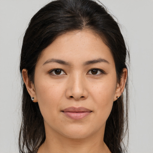 Joyful asian young-adult female with long  brown hair and brown eyes