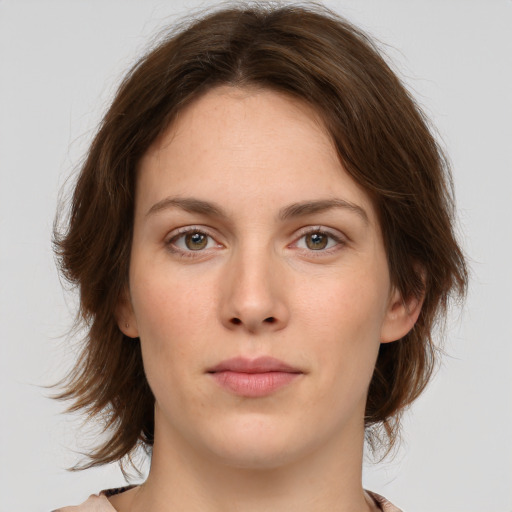 Neutral white young-adult female with medium  brown hair and green eyes