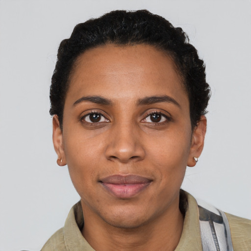 Joyful latino adult female with short  black hair and brown eyes