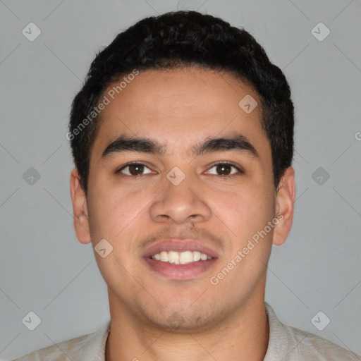 Joyful latino young-adult male with short  black hair and brown eyes