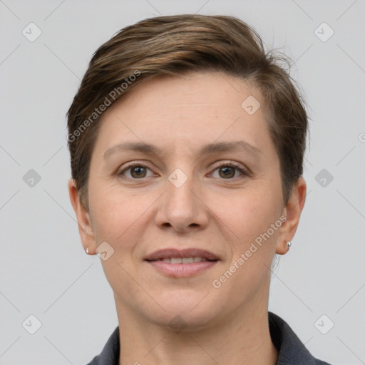 Joyful white young-adult female with short  brown hair and grey eyes