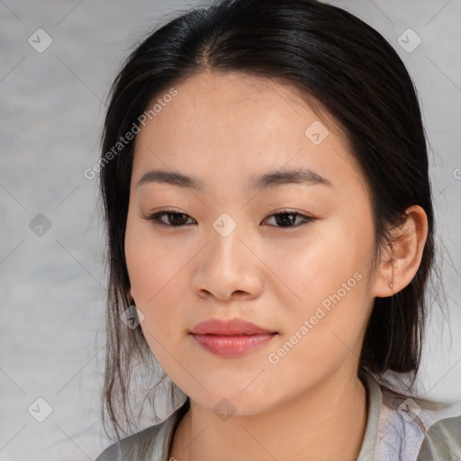 Joyful asian young-adult female with medium  black hair and brown eyes