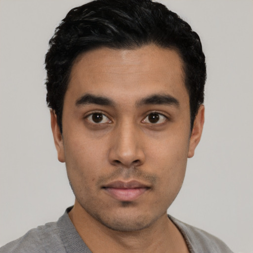 Neutral latino young-adult male with short  black hair and brown eyes