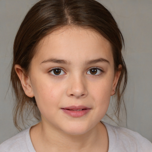 Joyful white child female with medium  brown hair and brown eyes