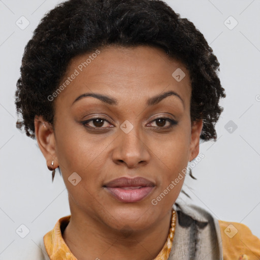 Joyful black young-adult female with short  brown hair and brown eyes