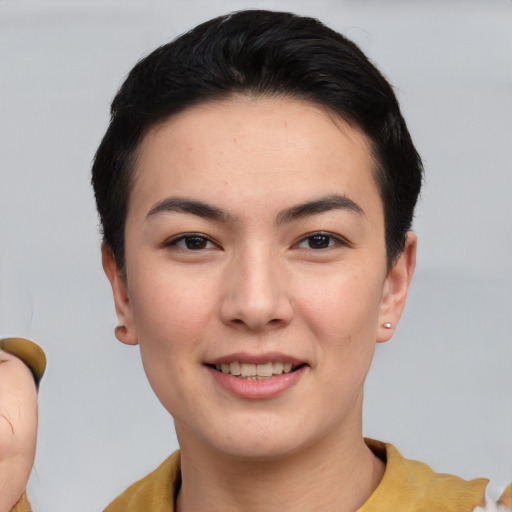 Joyful asian young-adult female with short  black hair and brown eyes