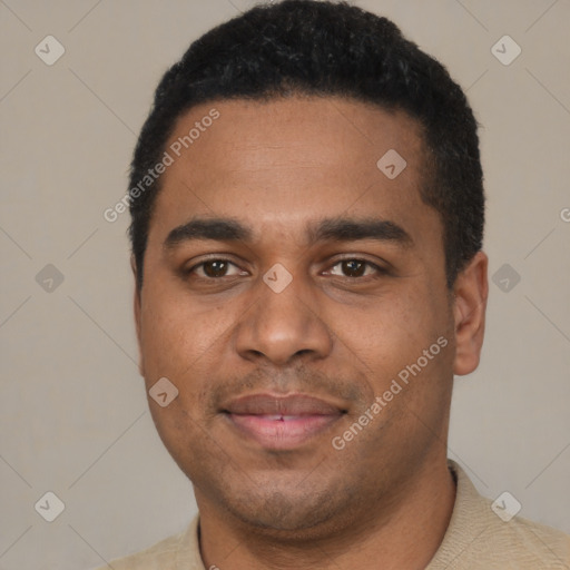 Joyful black young-adult male with short  black hair and brown eyes