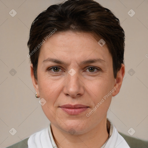 Joyful white adult female with short  brown hair and brown eyes