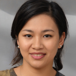 Joyful white young-adult female with medium  brown hair and brown eyes